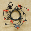 Two Inch Orange Berry Taper Candle Ring with Black Stars